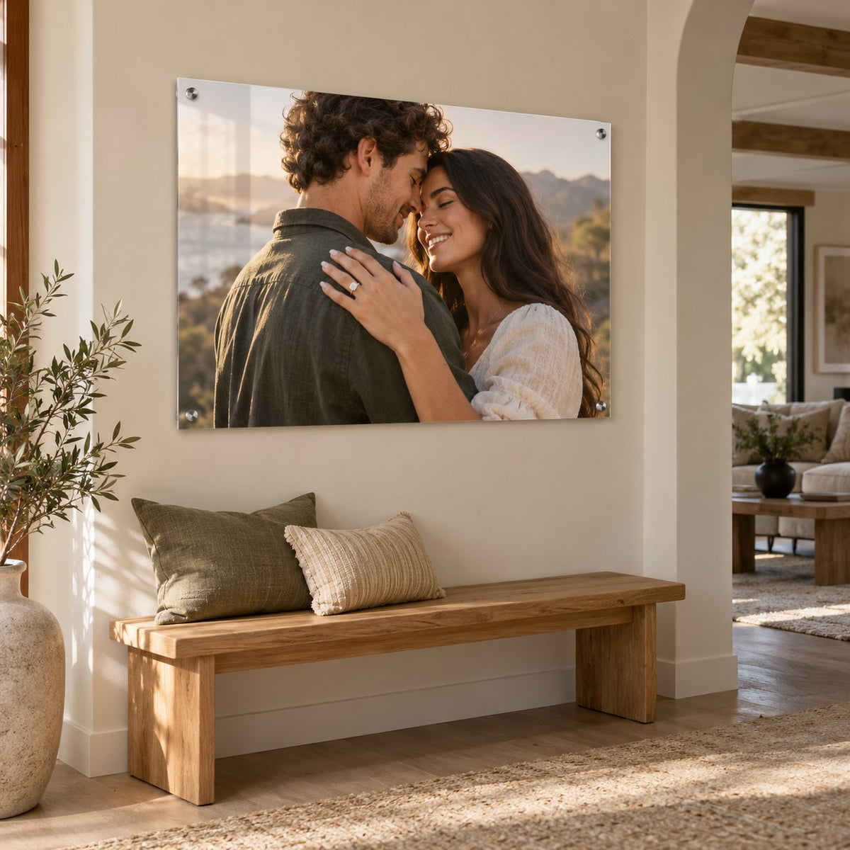 Engagement photo of a couple embracing printed on clear acrylic and hung above an entryway bench