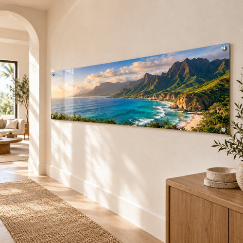Panoramic coastline travel photo on a long clear acrylic print hung in a hallway
