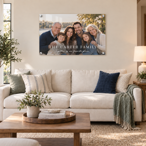 42 × 28 inch personalized family portrait acrylic print hung above a sofa in a living room
